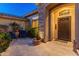 Entry courtyard with seating area and ornate door at 2310 W Hazelhurst Dr, Anthem, AZ 85086