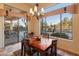 Bright dining area with a wooden table and stunning mountain views at 2310 W Hazelhurst Dr, Anthem, AZ 85086