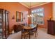 Bright dining room with a large window and wood table at 2310 W Hazelhurst Dr, Anthem, AZ 85086