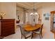 Formal dining room with a wood table and four chairs at 2310 W Hazelhurst Dr, Anthem, AZ 85086