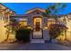 Elegant home exterior with ornate entry gate and landscaping at 2310 W Hazelhurst Dr, Anthem, AZ 85086