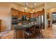 Modern kitchen with granite countertops, stainless steel appliances, and wood cabinets at 2310 W Hazelhurst Dr, Anthem, AZ 85086