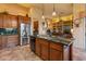 Modern kitchen with granite countertops and wood cabinets at 2310 W Hazelhurst Dr, Anthem, AZ 85086