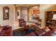 Cozy living room featuring leather seating and a wood coffee table at 2310 W Hazelhurst Dr, Anthem, AZ 85086