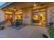 Covered patio with comfortable seating, providing an ideal outdoor dining space at 2310 W Hazelhurst Dr, Anthem, AZ 85086