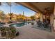 Relaxing backyard oasis with a sparkling pool and patio at 2310 W Hazelhurst Dr, Anthem, AZ 85086