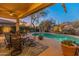 Inviting pool area with patio furniture, offering a relaxing resort-style atmosphere at 2310 W Hazelhurst Dr, Anthem, AZ 85086