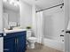 Clean bathroom with white subway tile and blue vanity at 2425 W Bronco Butte Trl # 1032, Phoenix, AZ 85085