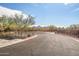 Landscaped entrance to community with paved road and mountain views at 2425 W Bronco Butte Trl # 1032, Phoenix, AZ 85085