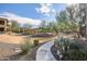 Curving pathway through desert landscaping leads to community amenities at 2425 W Bronco Butte Trl # 1032, Phoenix, AZ 85085