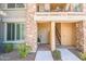 Inviting condo entryway with stone accents and private balcony at 2425 W Bronco Butte Trl # 1032, Phoenix, AZ 85085