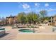 Community spa with nearby lounge chairs and building in background at 2425 W Bronco Butte Trl # 1032, Phoenix, AZ 85085