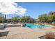 Community pool with lounge chairs and surrounding desert landscaping at 2425 W Bronco Butte Trl # 1032, Phoenix, AZ 85085