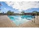 Community pool with plenty of lounge chairs and shaded seating at 2425 W Bronco Butte Trl # 1032, Phoenix, AZ 85085