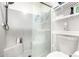 Shower, toilet and shelving in this clean bathroom at 2535 W Canyon Crest Cir, Phoenix, AZ 85023