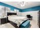 Bedroom with ceiling fan, two windows, and a teal bench at 2535 W Canyon Crest Cir, Phoenix, AZ 85023