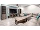 Living room with sectional sofa, wood coffee table, and built-in shelving at 2535 W Canyon Crest Cir, Phoenix, AZ 85023