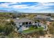 Aerial view of house, showcasing backyard oasis and mountain views at 26846 N 73Rd St, Scottsdale, AZ 85266