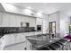 Spacious kitchen featuring granite island and white cabinetry at 26846 N 73Rd St, Scottsdale, AZ 85266