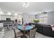 Open concept kitchen and dining area, featuring a breakfast bar and modern appliances at 26846 N 73Rd St, Scottsdale, AZ 85266