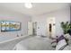 Bright main bedroom, featuring a king-size bed and a large flat-screen TV at 26846 N 73Rd St, Scottsdale, AZ 85266