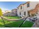 Spacious backyard with artificial turf and patio at 2715 S Sailors Way, Gilbert, AZ 85295