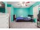 Bright bedroom with double bed, dresser, and ceiling fan at 2715 S Sailors Way, Gilbert, AZ 85295