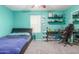 Teal bedroom with queen bed, desk, and ample closet space at 2715 S Sailors Way, Gilbert, AZ 85295