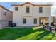 Two-story house with light-colored siding and a covered patio at 2715 S Sailors Way, Gilbert, AZ 85295