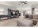 Open living area with gray walls, wood-look floors, and a view of the kitchen at 2715 S Sailors Way, Gilbert, AZ 85295