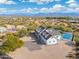 Aerial view of a home with a pool and pickleball court at 27921 N 153Rd St, Scottsdale, AZ 85262