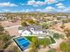 Aerial view of a home with pool, pickleball court, and mountain views at 27921 N 153Rd St, Scottsdale, AZ 85262