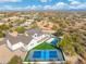 Aerial view showcasing a house, pool, and pickleball court at 27921 N 153Rd St, Scottsdale, AZ 85262