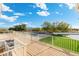 Elevated deck overlooks a sparkling pool, grassy yard, and basketball court at 27921 N 153Rd St, Scottsdale, AZ 85262