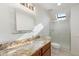 Modern bathroom with granite countertop and glass shower at 27921 N 153Rd St, Scottsdale, AZ 85262