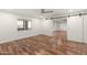 Bedroom with hardwood floors, ceiling fan, and barn doors at 27921 N 153Rd St, Scottsdale, AZ 85262