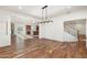 Spacious dining room features hardwood floors, a chandelier, and views of the kitchen at 27921 N 153Rd St, Scottsdale, AZ 85262