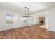 Bright dining room features hardwood floors, chandelier, and fireplace at 27921 N 153Rd St, Scottsdale, AZ 85262