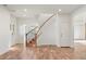 Light and bright entryway with hardwood floors and curved staircase at 27921 N 153Rd St, Scottsdale, AZ 85262