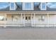 Two-story farmhouse with wraparound porch and white exterior at 27921 N 153Rd St, Scottsdale, AZ 85262