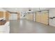 Large garage featuring two automatic doors and built-in storage at 27921 N 153Rd St, Scottsdale, AZ 85262