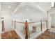 Elegant hallway with hardwood floors and white railing at 27921 N 153Rd St, Scottsdale, AZ 85262