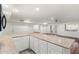 Modern kitchen with granite countertops and white cabinets at 27921 N 153Rd St, Scottsdale, AZ 85262