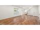 Bright and airy living room with hardwood floors and staircase view at 27921 N 153Rd St, Scottsdale, AZ 85262