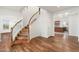 Elegant curved staircase with wood treads and white railing at 27921 N 153Rd St, Scottsdale, AZ 85262