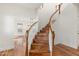 Open staircase with hardwood floors and white railings at 27921 N 153Rd St, Scottsdale, AZ 85262