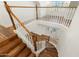 Stunning curved staircase with wood and white railings at 27921 N 153Rd St, Scottsdale, AZ 85262