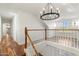 Bright upstairs hall with hardwood floors and chandelier at 27921 N 153Rd St, Scottsdale, AZ 85262