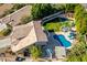 Aerial view of house with pool, spa, and large backyard at 3210 E Brookwood Ct, Phoenix, AZ 85048