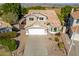 Two-story house with tan exterior and tile roof at 3210 E Brookwood Ct, Phoenix, AZ 85048